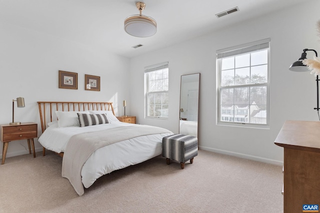 bedroom with light carpet