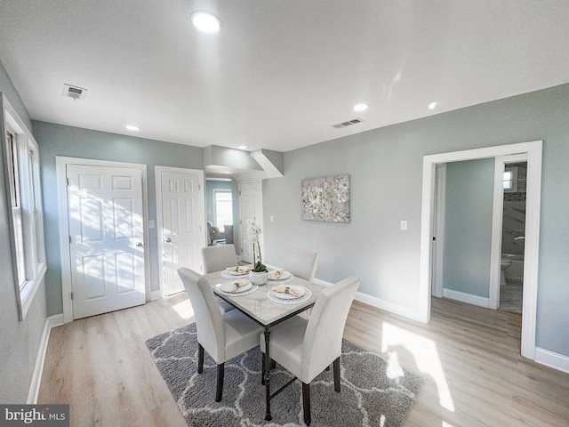 dining area featuring light wood-type flooring