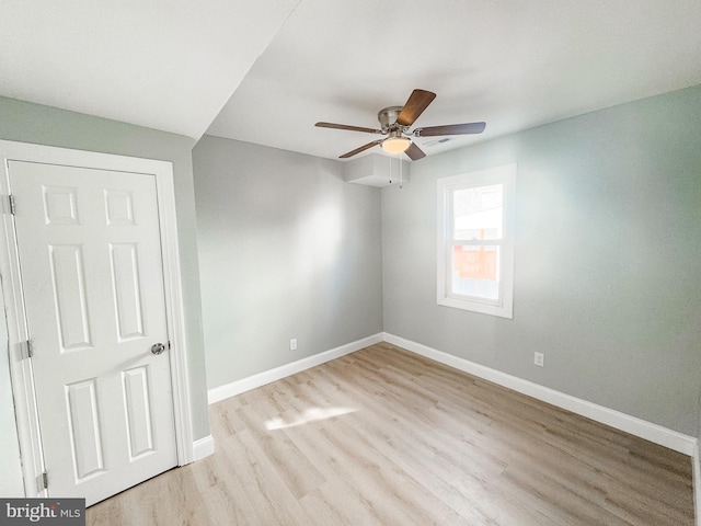 unfurnished room featuring ceiling fan and light wood-type flooring