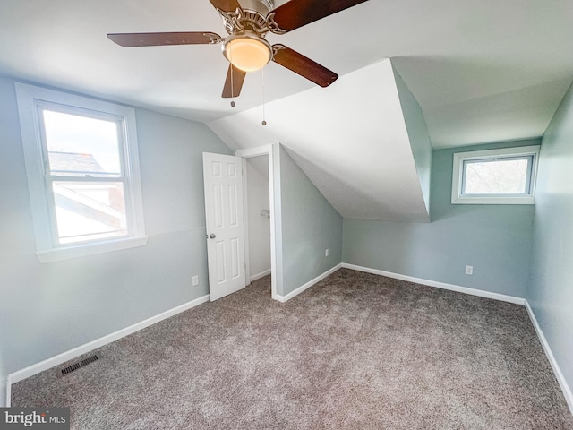 bonus room with ceiling fan, vaulted ceiling, and carpet