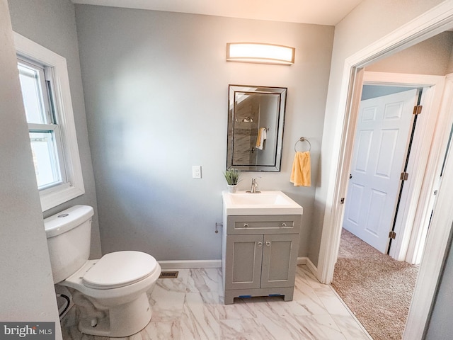 bathroom with vanity and toilet