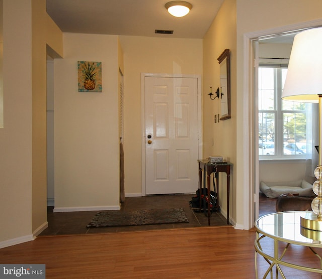 foyer with dark hardwood / wood-style floors