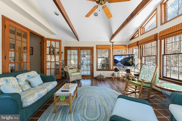 tiled living room featuring french doors, a ceiling fan, and vaulted ceiling with beams