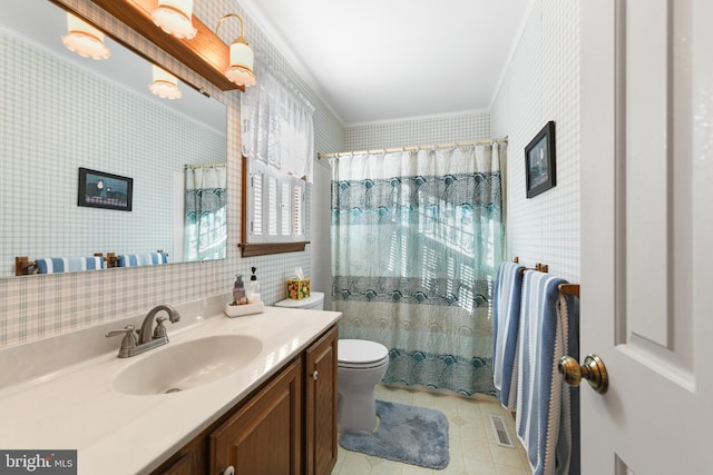 bathroom with vanity, visible vents, ornamental molding, tile patterned floors, and toilet