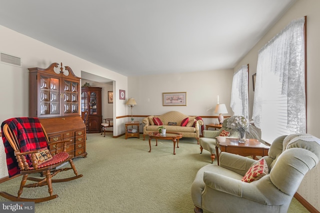 living room with visible vents and carpet