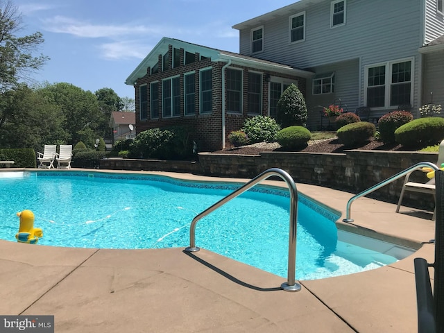 pool featuring a patio area