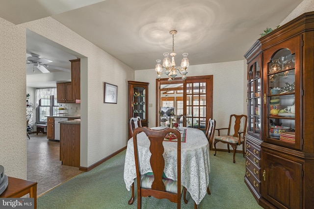 dining space featuring baseboards and wallpapered walls