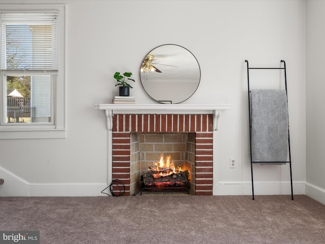 details featuring carpet floors and a brick fireplace