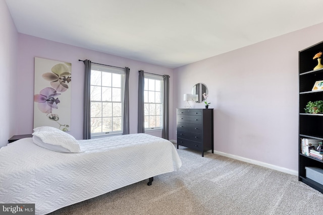 carpeted bedroom with baseboards