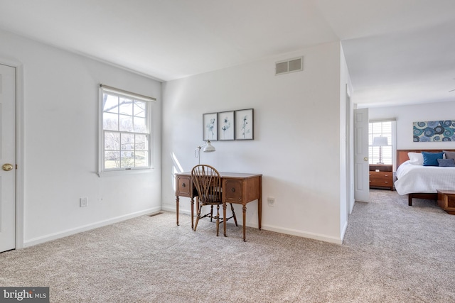 bedroom featuring baseboards, visible vents, and carpet flooring