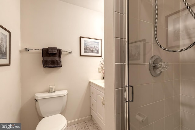 full bath featuring baseboards, toilet, marble finish floor, vanity, and a shower stall