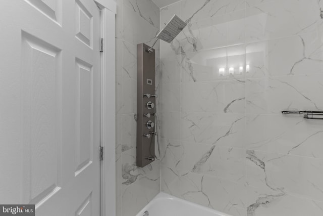 bathroom featuring tiled shower / bath combo