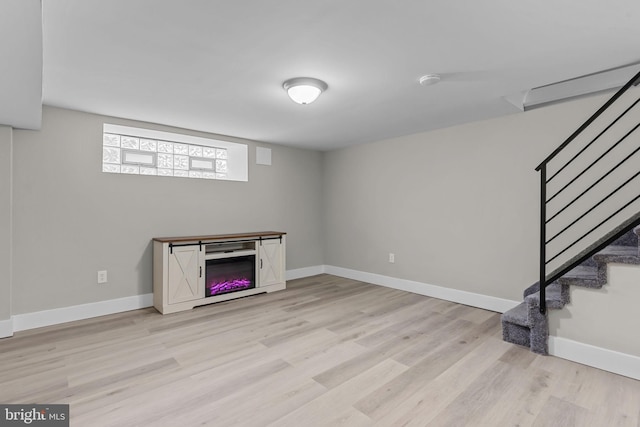 basement featuring light hardwood / wood-style flooring