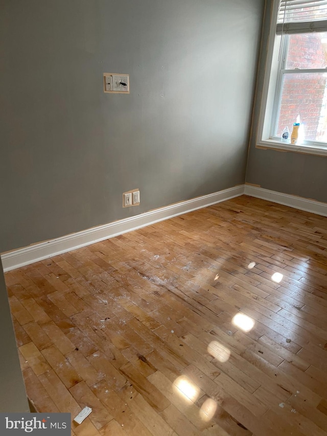 empty room with light hardwood / wood-style floors