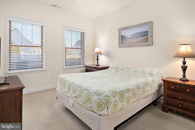 bedroom featuring light colored carpet