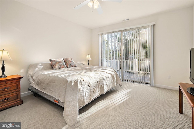 carpeted bedroom featuring access to exterior and ceiling fan