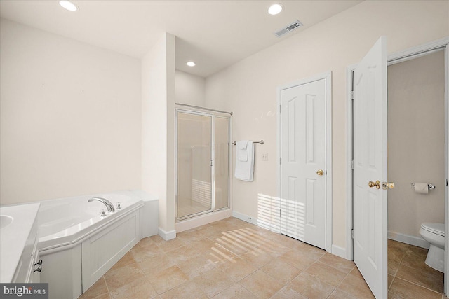 bathroom with tile patterned floors, independent shower and bath, and toilet