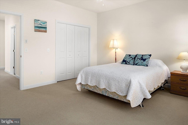 carpeted bedroom featuring a closet