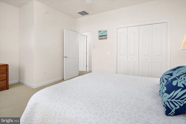 carpeted bedroom with a closet