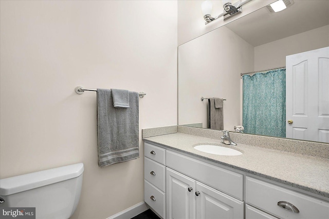 bathroom with vanity and toilet