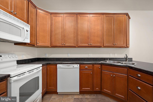 kitchen featuring white appliances and sink