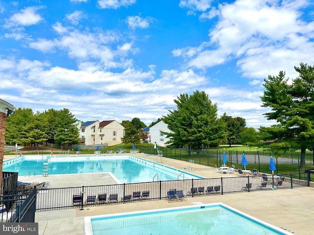 view of swimming pool featuring a patio