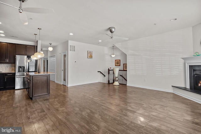 living room with hardwood / wood-style flooring and ceiling fan