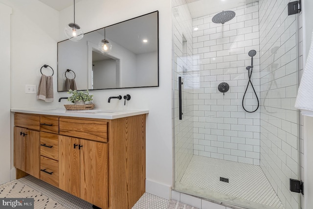 bathroom with tile patterned flooring, vanity, and an enclosed shower