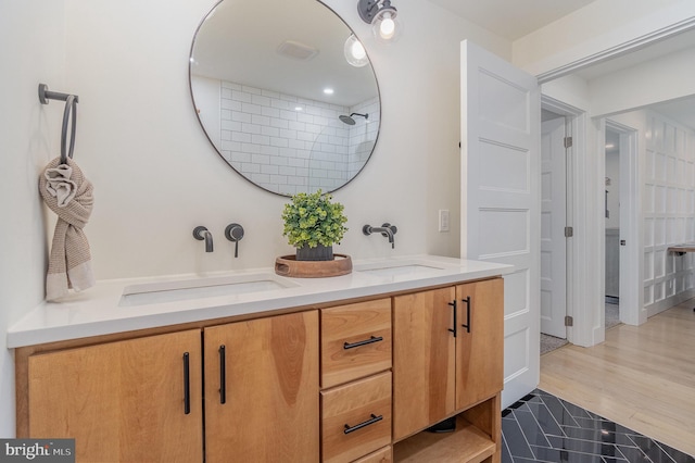 bathroom with vanity and wood-type flooring