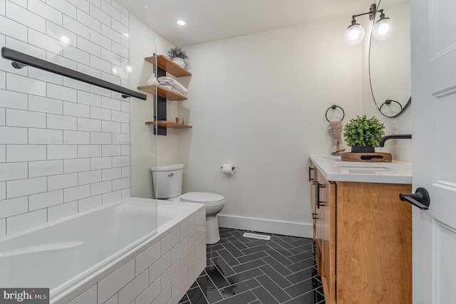 full bathroom with vanity, toilet, and tiled shower / bath