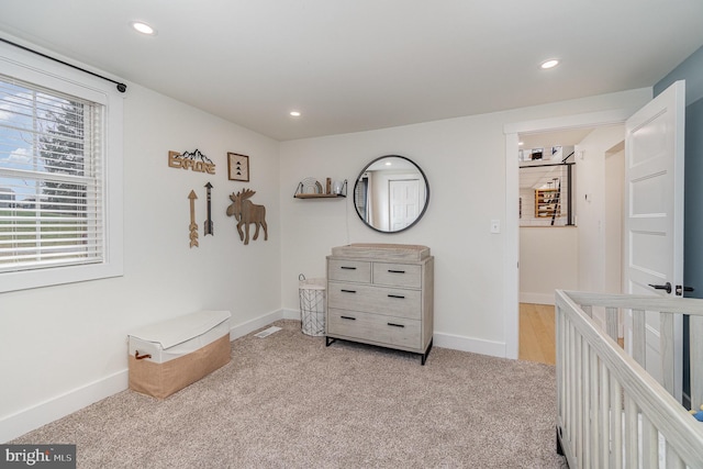 bedroom featuring light colored carpet