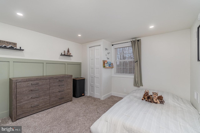 carpeted bedroom featuring a closet