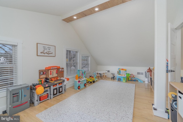 game room with lofted ceiling and light wood-type flooring