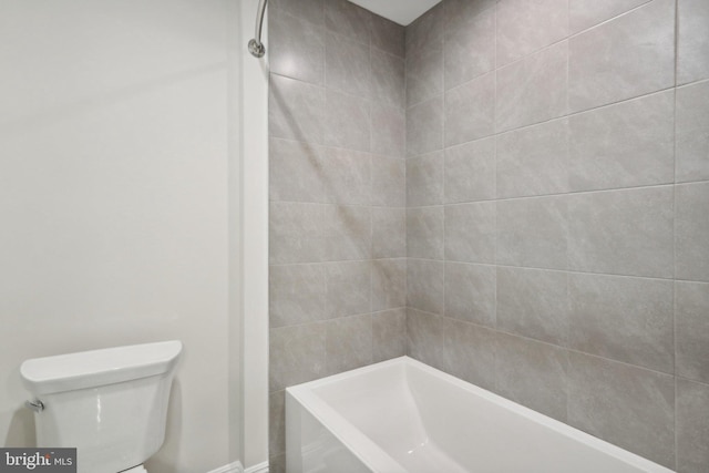 bathroom with shower / washtub combination and toilet