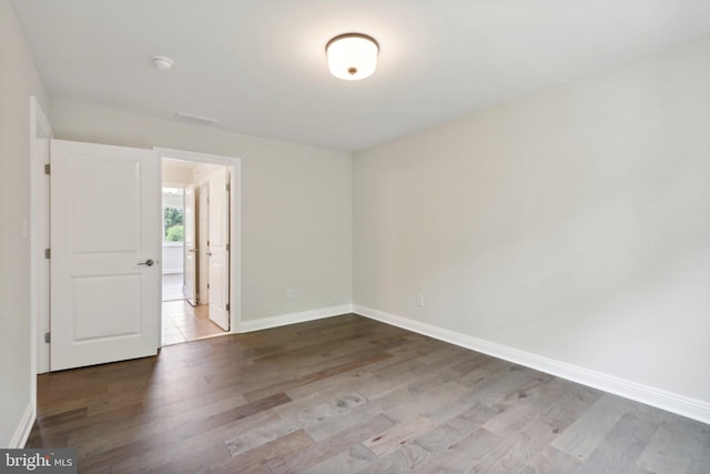 empty room featuring hardwood / wood-style flooring