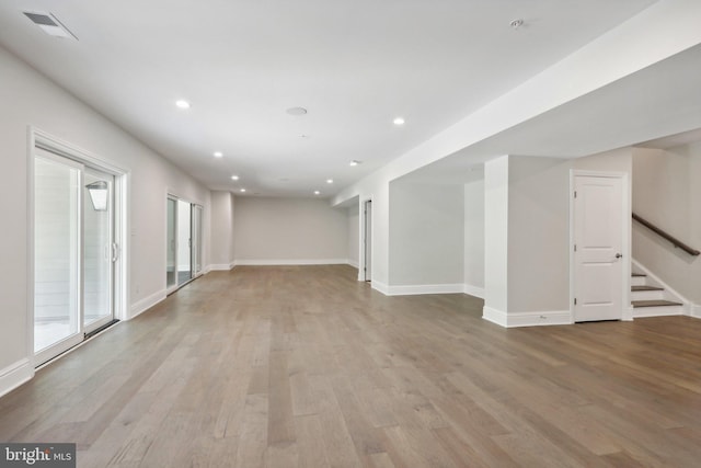 spare room with light hardwood / wood-style floors