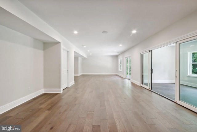 spare room with light hardwood / wood-style flooring