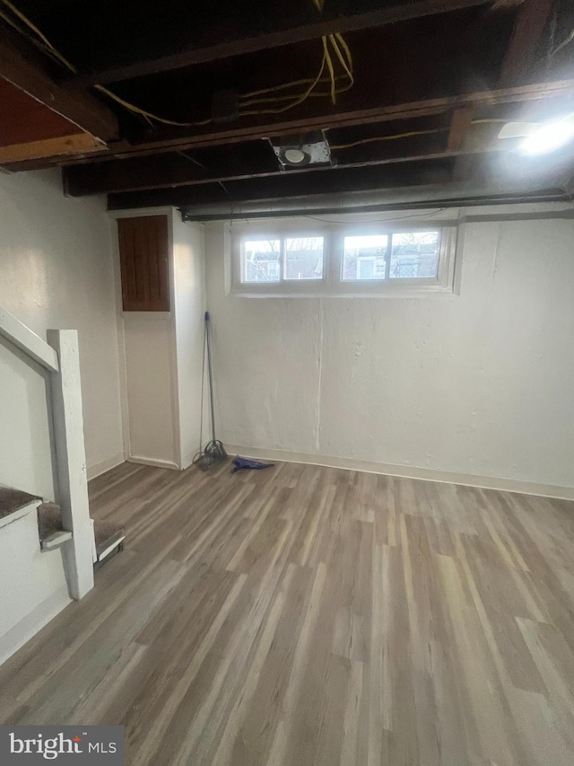 basement featuring wood-type flooring