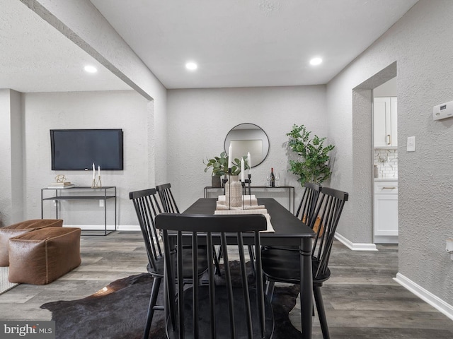 dining area with dark wood-type flooring