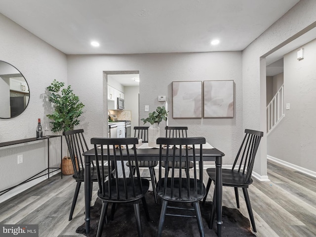 dining area with light hardwood / wood-style floors