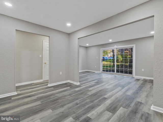 spare room with hardwood / wood-style floors