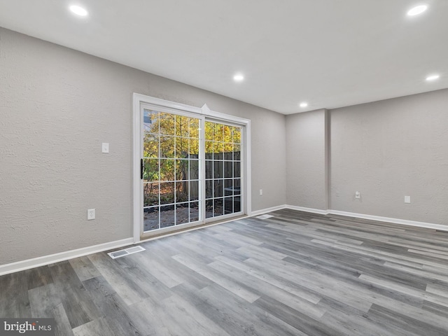 empty room featuring hardwood / wood-style flooring