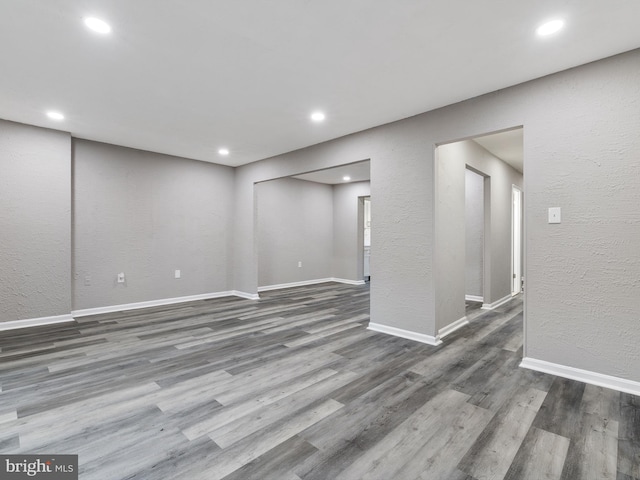 unfurnished room featuring dark hardwood / wood-style flooring