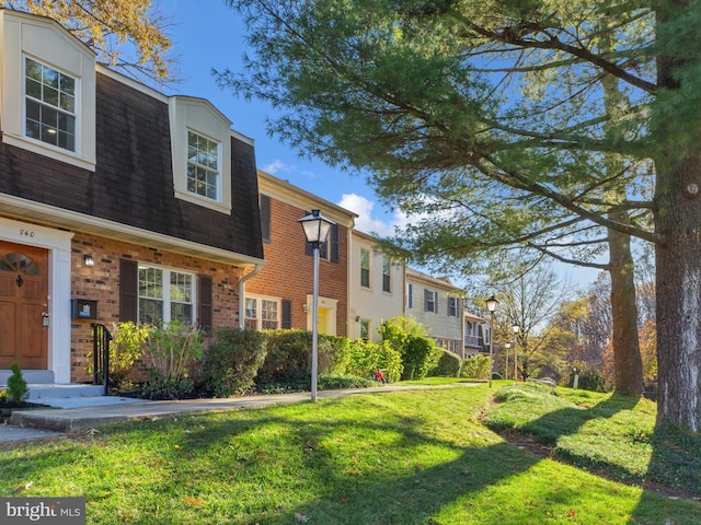 view of property exterior with a lawn