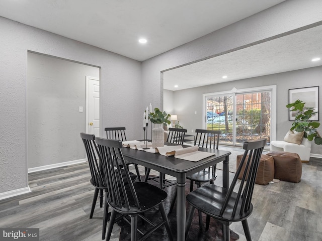 dining area featuring wood-type flooring