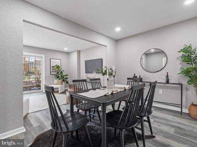 dining room with hardwood / wood-style flooring