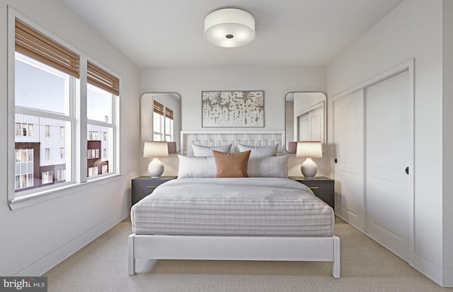 carpeted bedroom with a closet