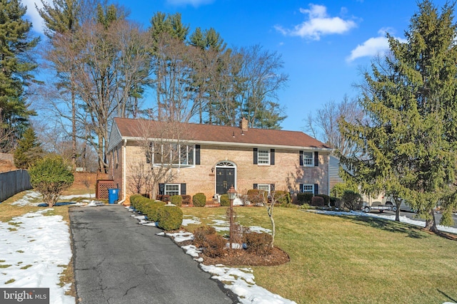 raised ranch with a front lawn