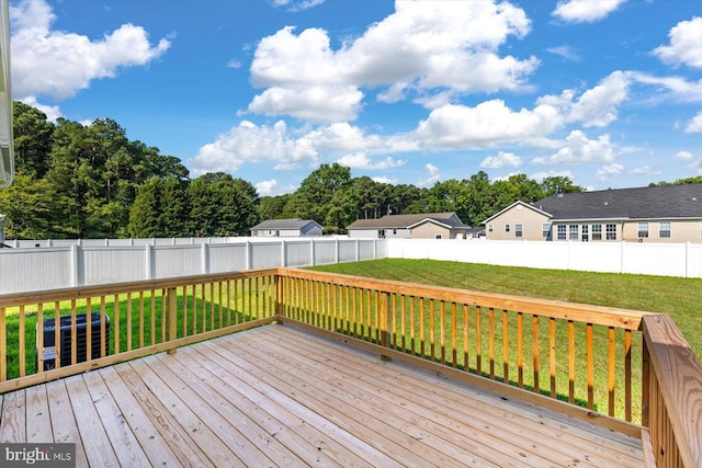 wooden deck with a fenced backyard, a residential view, central AC, and a yard