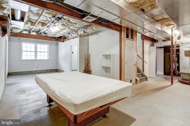 interior space featuring pool table and concrete flooring